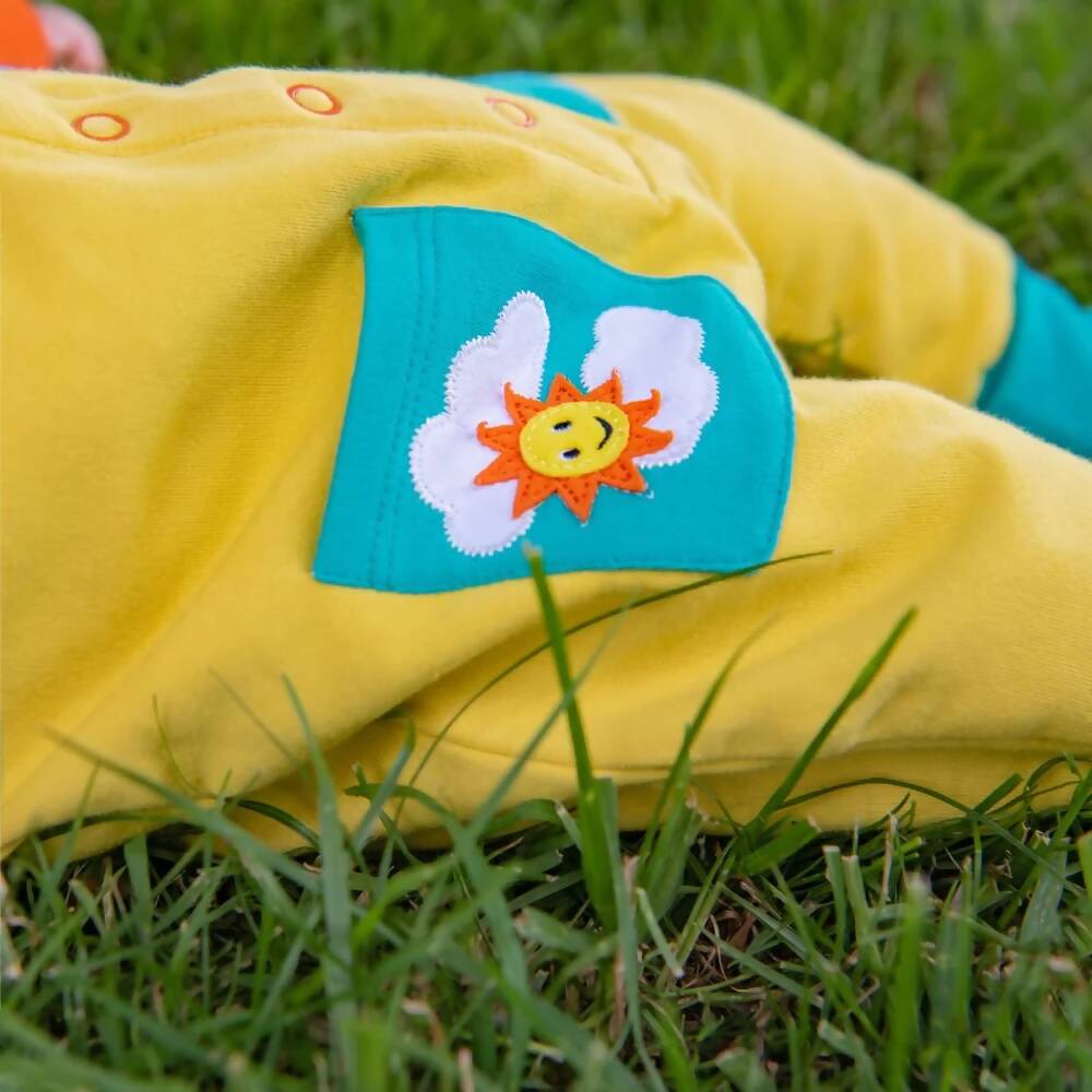 Baby_Yellow_Romper_Turquoise_Pockts_Sun_Cloud_Applique_Ducky_Zebra_1000x.jpg