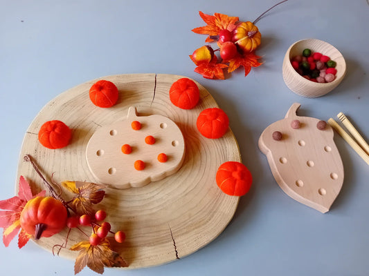 Child in handmade eco-friendly Halloween costume with carved pumpkin - sustainable Halloween ideas for kids UK | Kiddykind