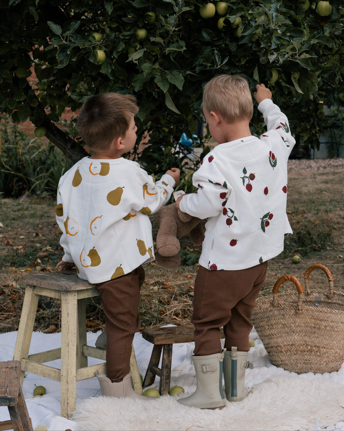 Children in organic cotton orchard collection sweaters and leggings - is polyester clothing harmful for children's health UK | Kiddykind