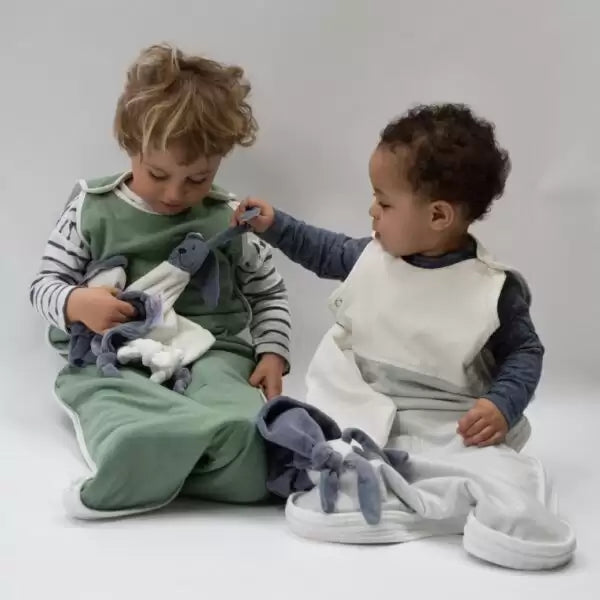 Children wearing colourful sustainable clothing outdoors - what sustainable fashion means for families UK | Kiddykind