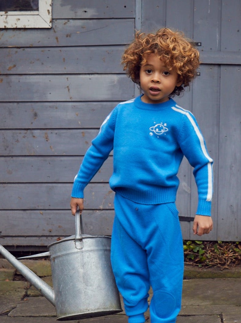 Zoom, zoom, zoom, we’re going to the moon. Jet off into space with our cosy little Galaxy Jumper complete with an embroidered planet surrounded by stars. It will certainly appeal to all young space lovers!  Made with the softest cashmere/ merino blend from Inner Mongolia, it will keep you Little One cosy and warm all winter long. 