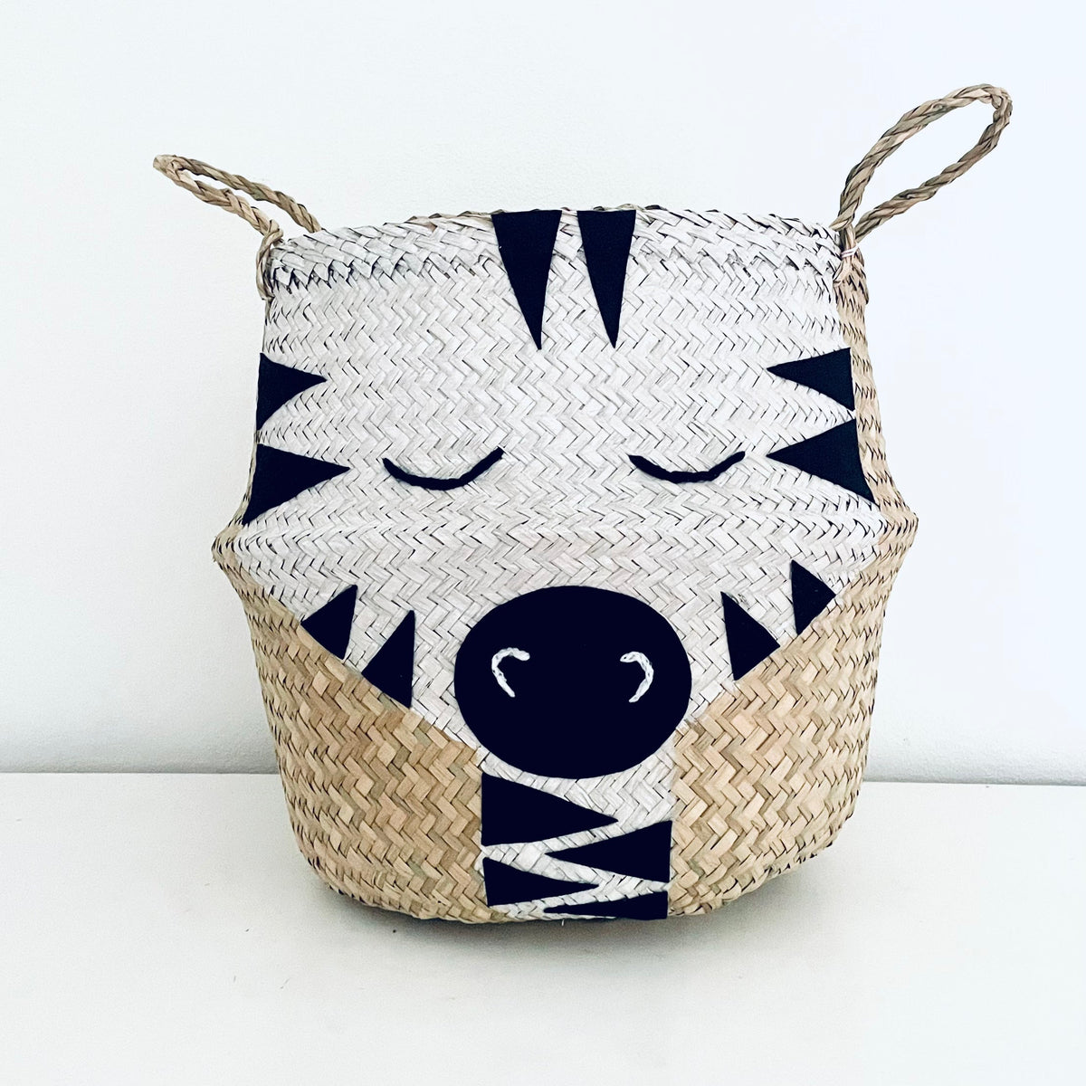 Handwoven seagrass zebra storage basket with felt stripes
