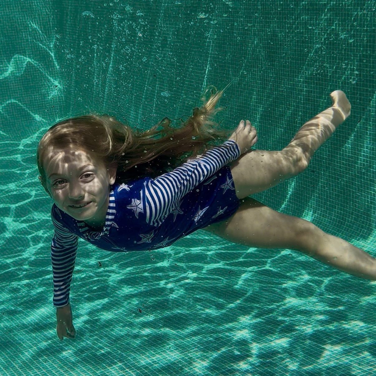 Long Sleeve Swimming Costume Blue lifestyle - organic cotton kids swimwear sustainable UK | Kiddykind