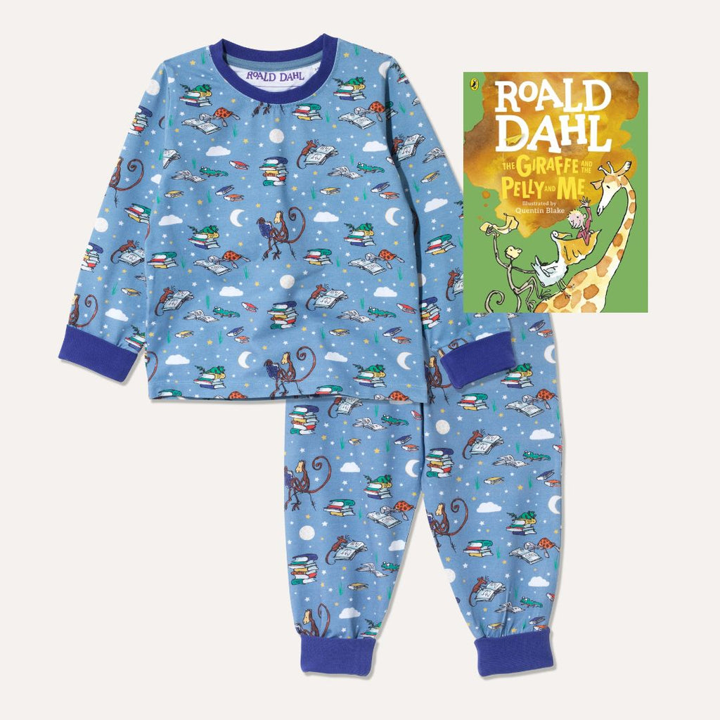 Image of Roald Dahl's 'The Giraffe and the Pelly and Me' book alongside a pair of Ducky Zebra x Roald Dahl purple/blue pyjamas with various animals from Roald Dahl stories reading books together