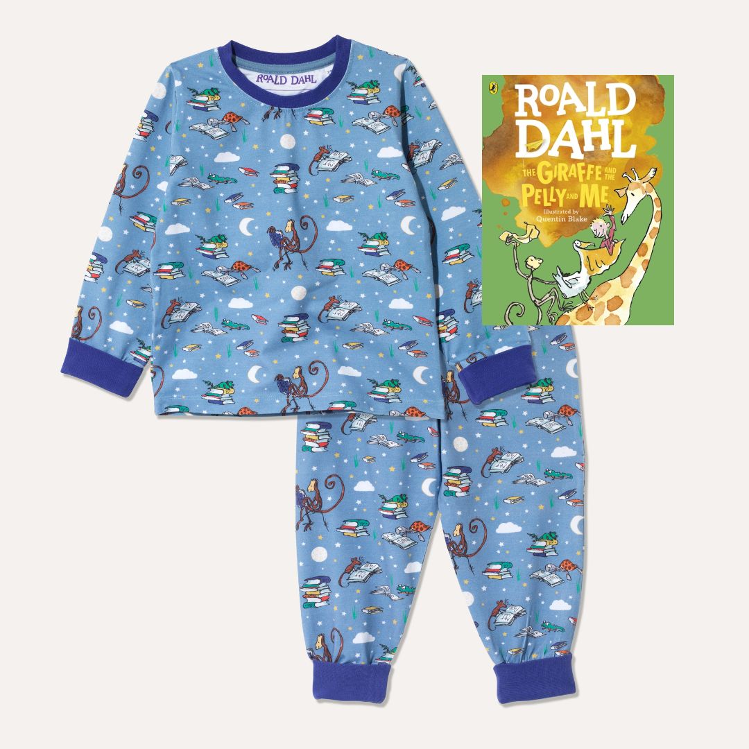 Image of Roald Dahl's 'The Giraffe and the Pelly and Me' book alongside a pair of Ducky Zebra x Roald Dahl purple/blue pyjamas with various animals from Roald Dahl stories reading books together