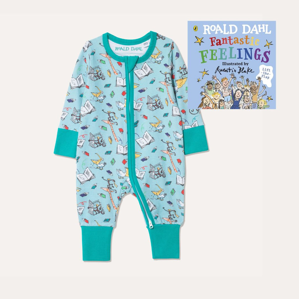 Image of Roald Dahl's 'Fantastic Feelings' Board Book alongside Ducky Zebra's Roald Dahl aqua Zip-up Sleepsuit with a fun print, featuring animals from 'The Giraffe and the Pelly and Me'.