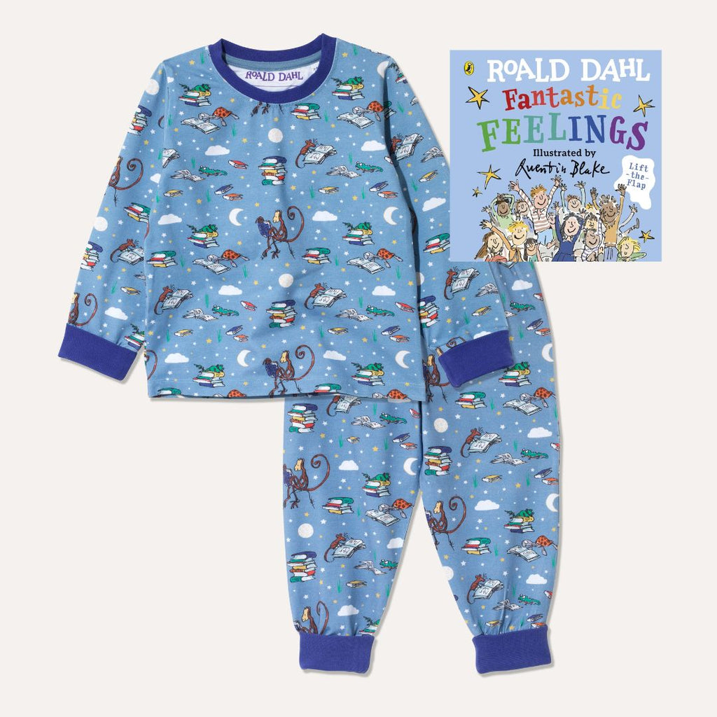 Image of Roald Dahl's 'Fantastic Feelings' board book alongside a pair of Ducky Zebra x Roald Dahl purple/blue pyjamas with an all over print of various animals from Roald Dahl stories reading books together