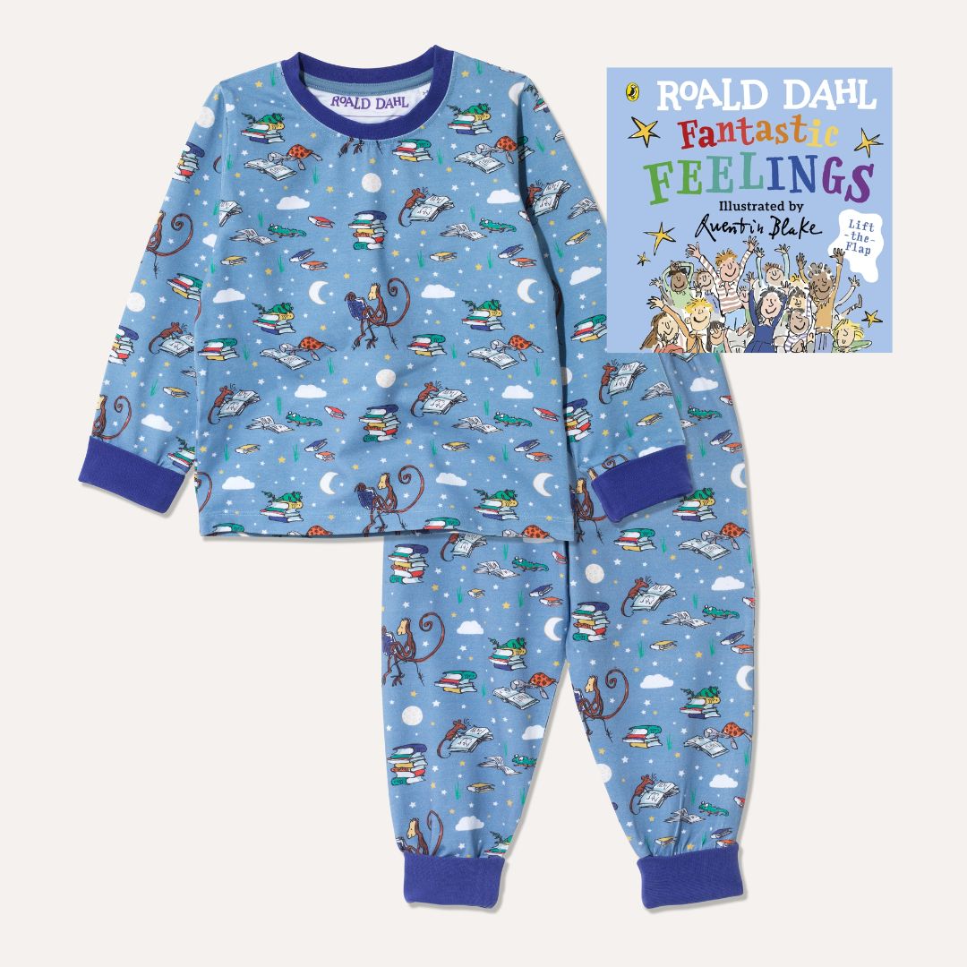 Image of Roald Dahl's 'Fantastic Feelings' board book alongside a pair of Ducky Zebra x Roald Dahl purple/blue pyjamas with an all over print of various animals from Roald Dahl stories reading books together
