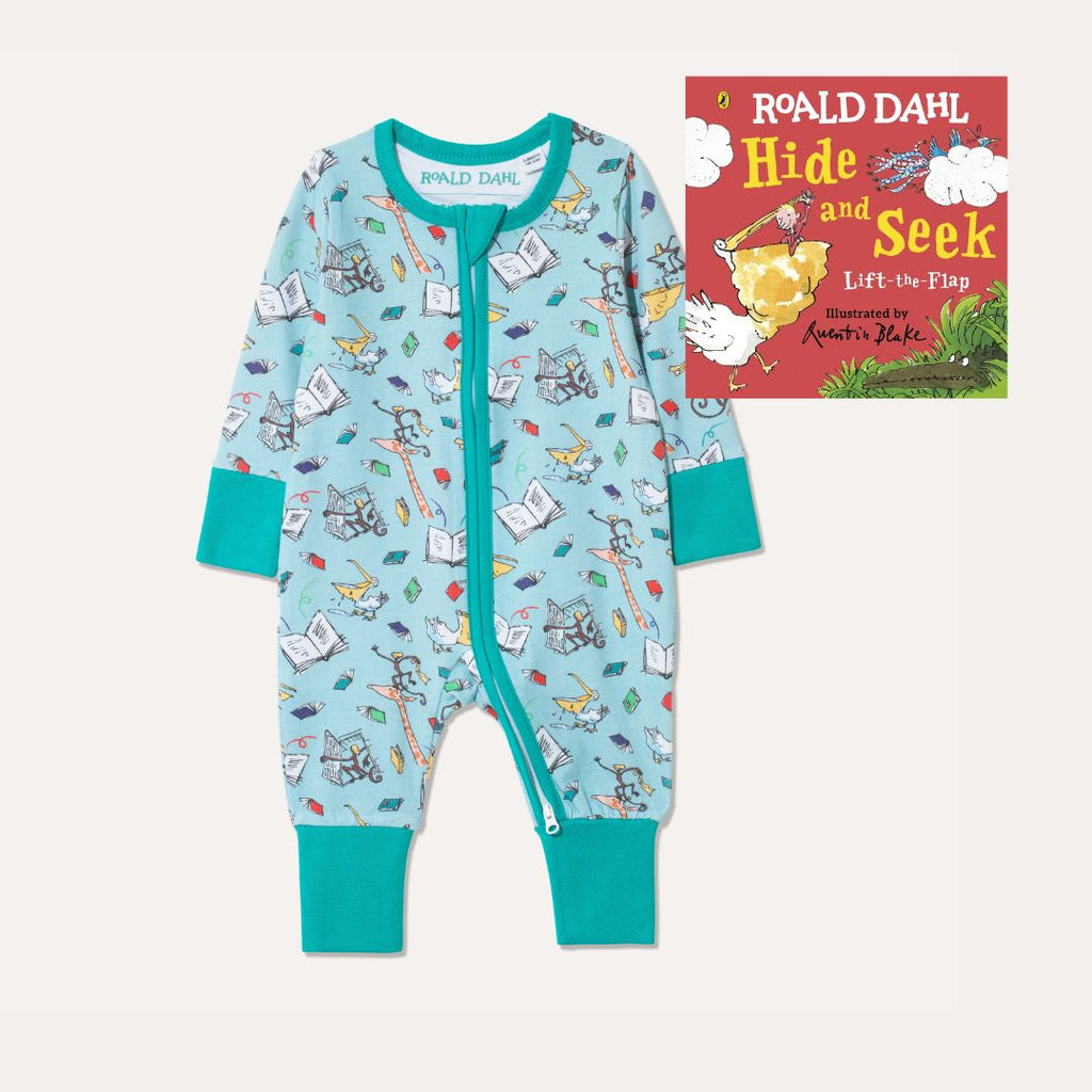 Image of Roald Dahl's 'Hide and Seek' Board Book alongside Ducky Zebra's Roald Dahl aqua Zip-up Sleepsuit with a fun print, featuring animals from 'The Giraffe and the Pelly and Me'.