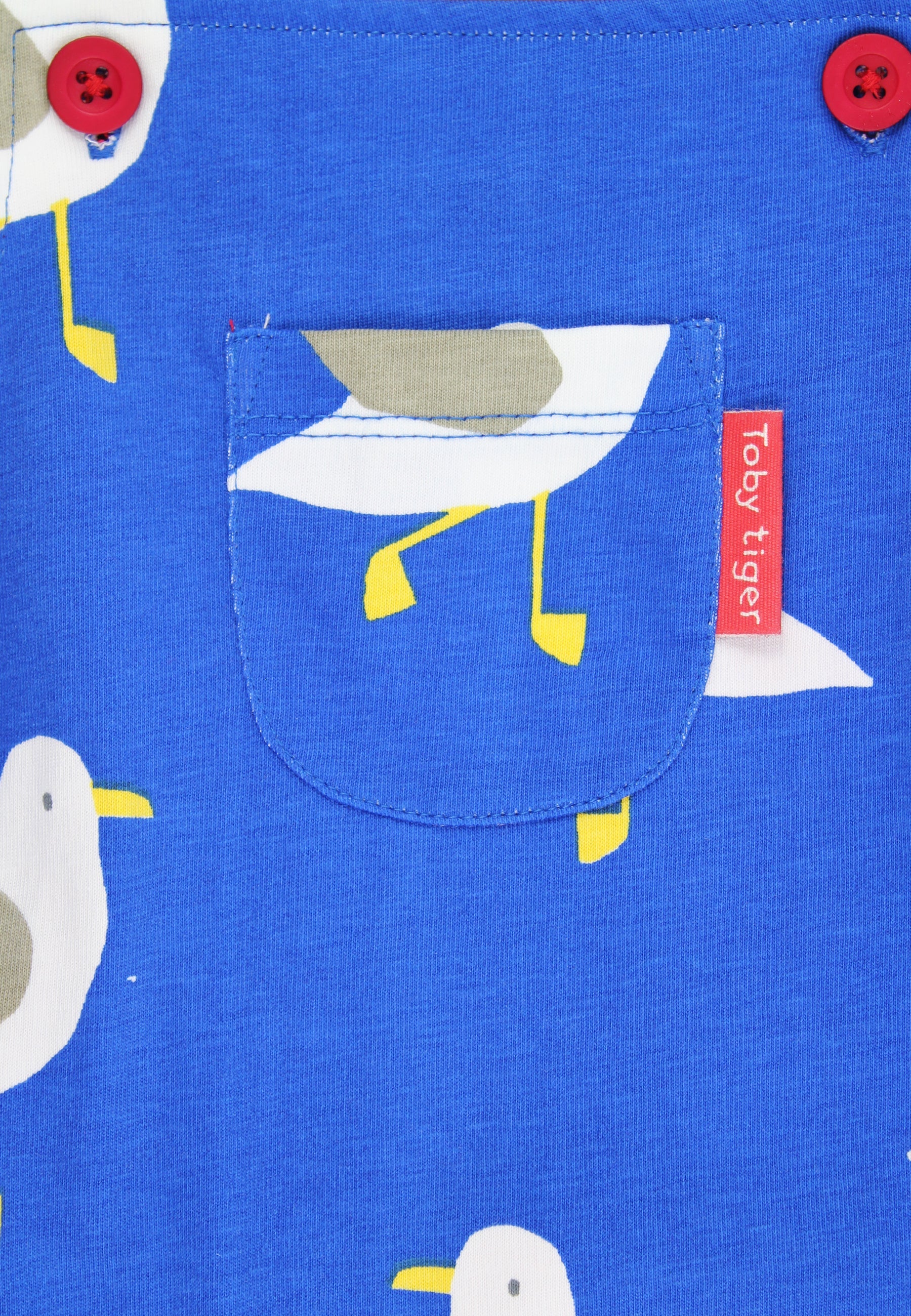 Blue fabric with seagull pattern and 'Toby Tiger' label