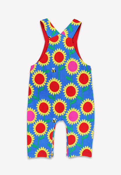 Colorful sunflower-patterned overalls on a white background