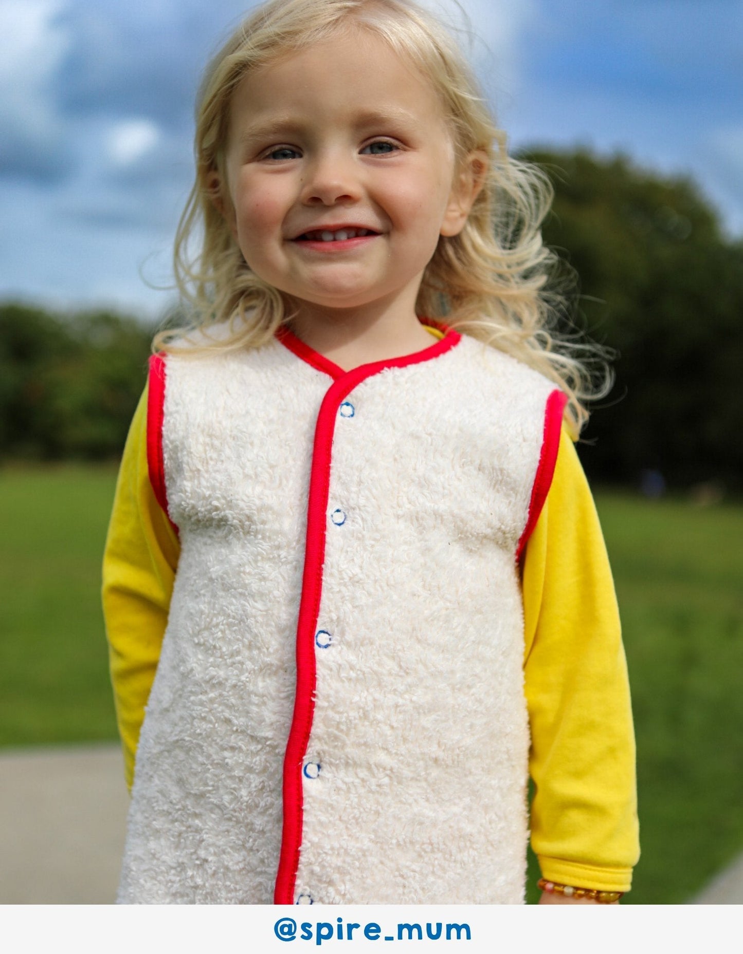 Luxury ethical baby: Organic Bold Floral Reversible Gilet | KIDDYKIND UK