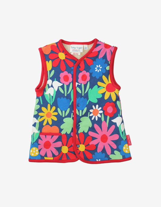 Luxury ethical baby: Organic Bold Floral Reversible Gilet | KIDDYKIND UK