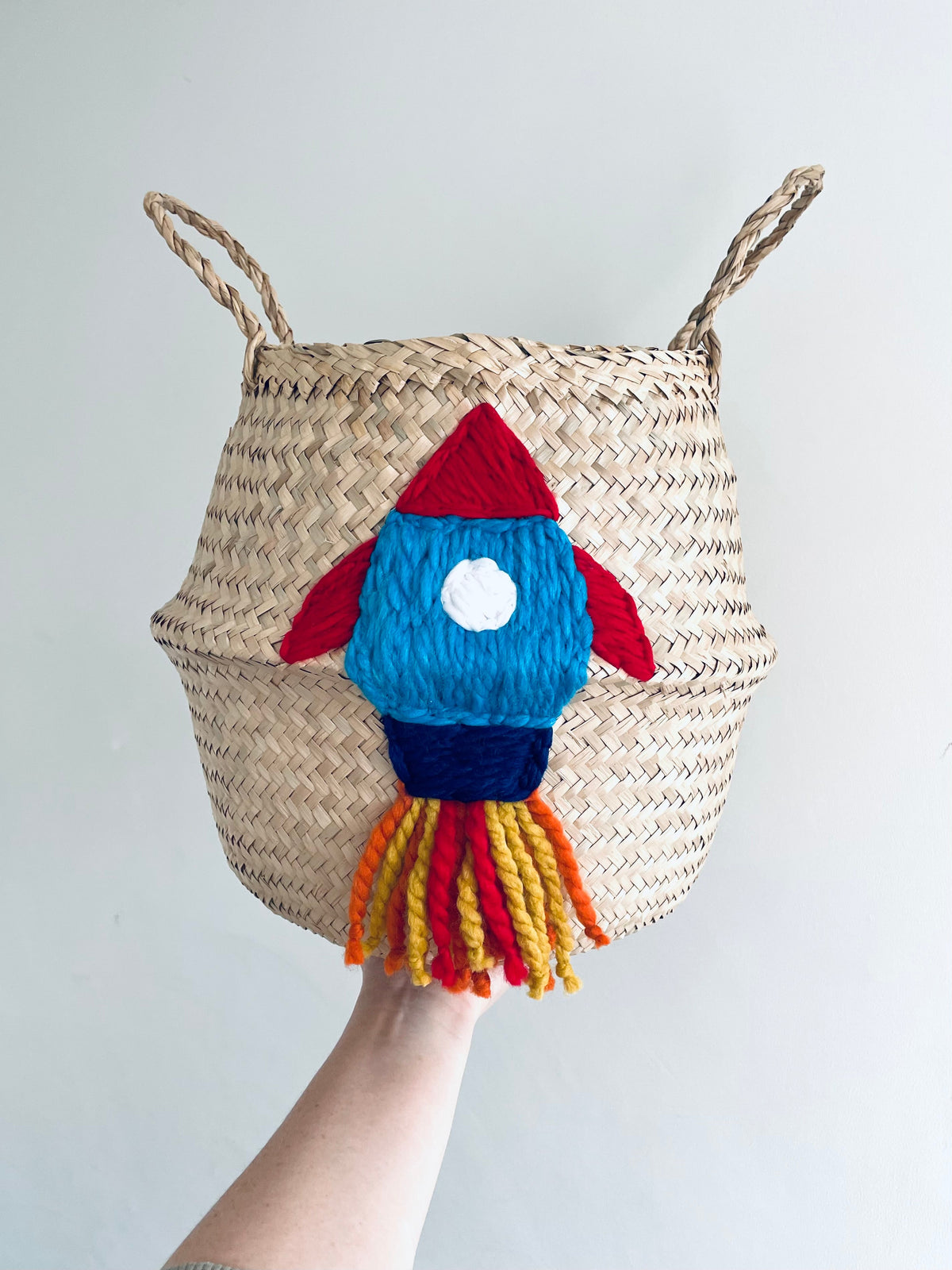 Handwoven seagrass red and blue rocket storage basket, view 4