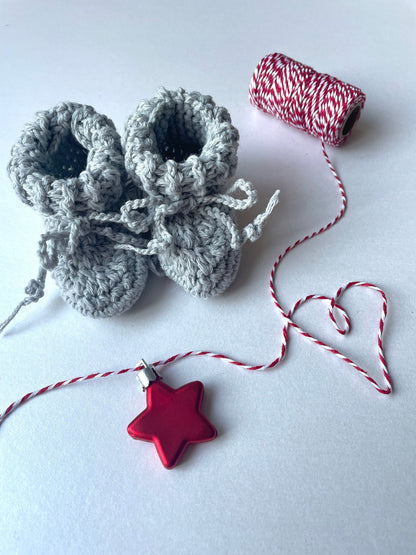 image shows light grey organic wool baby booties