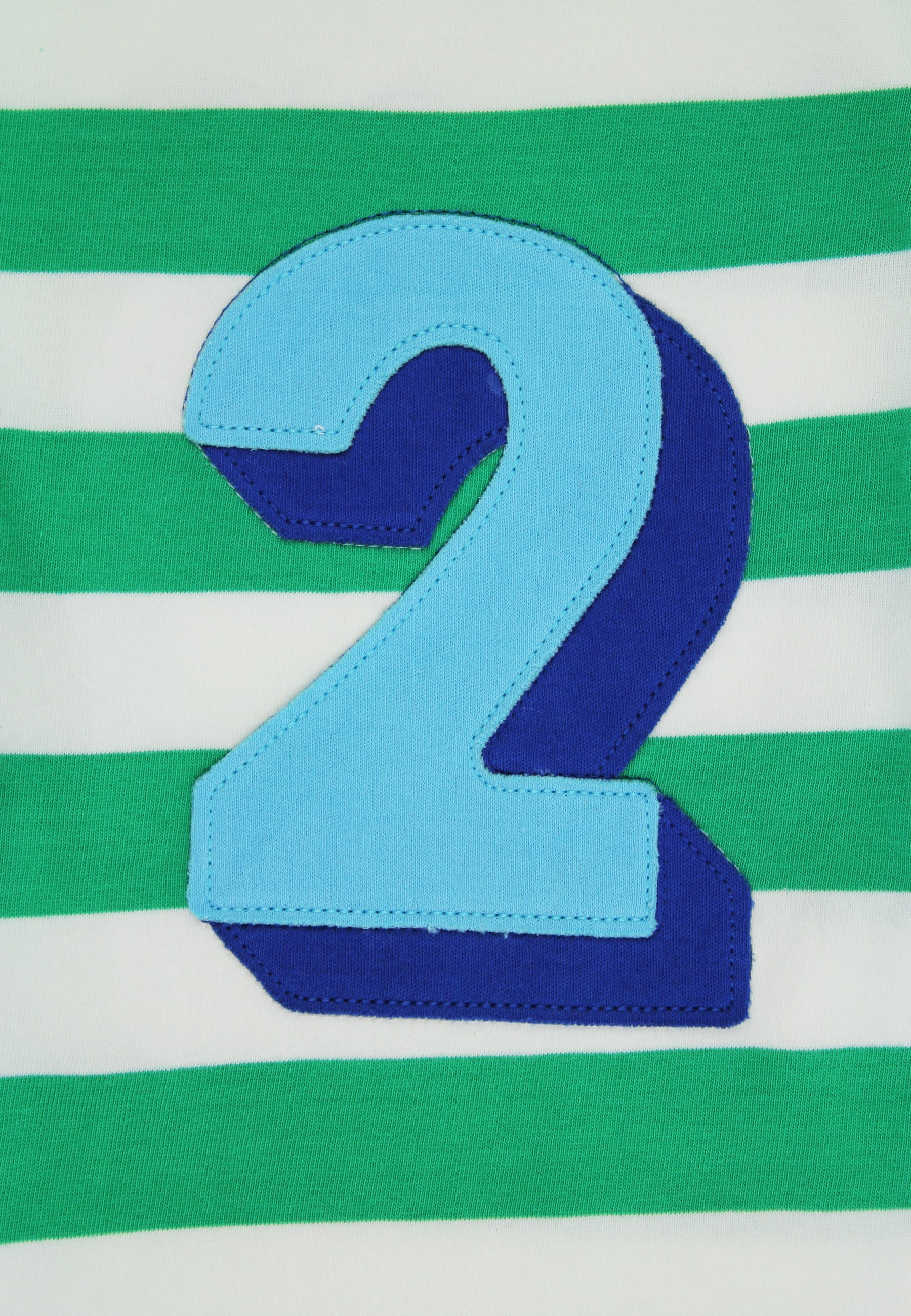 Blue number '2' on a green and white striped background