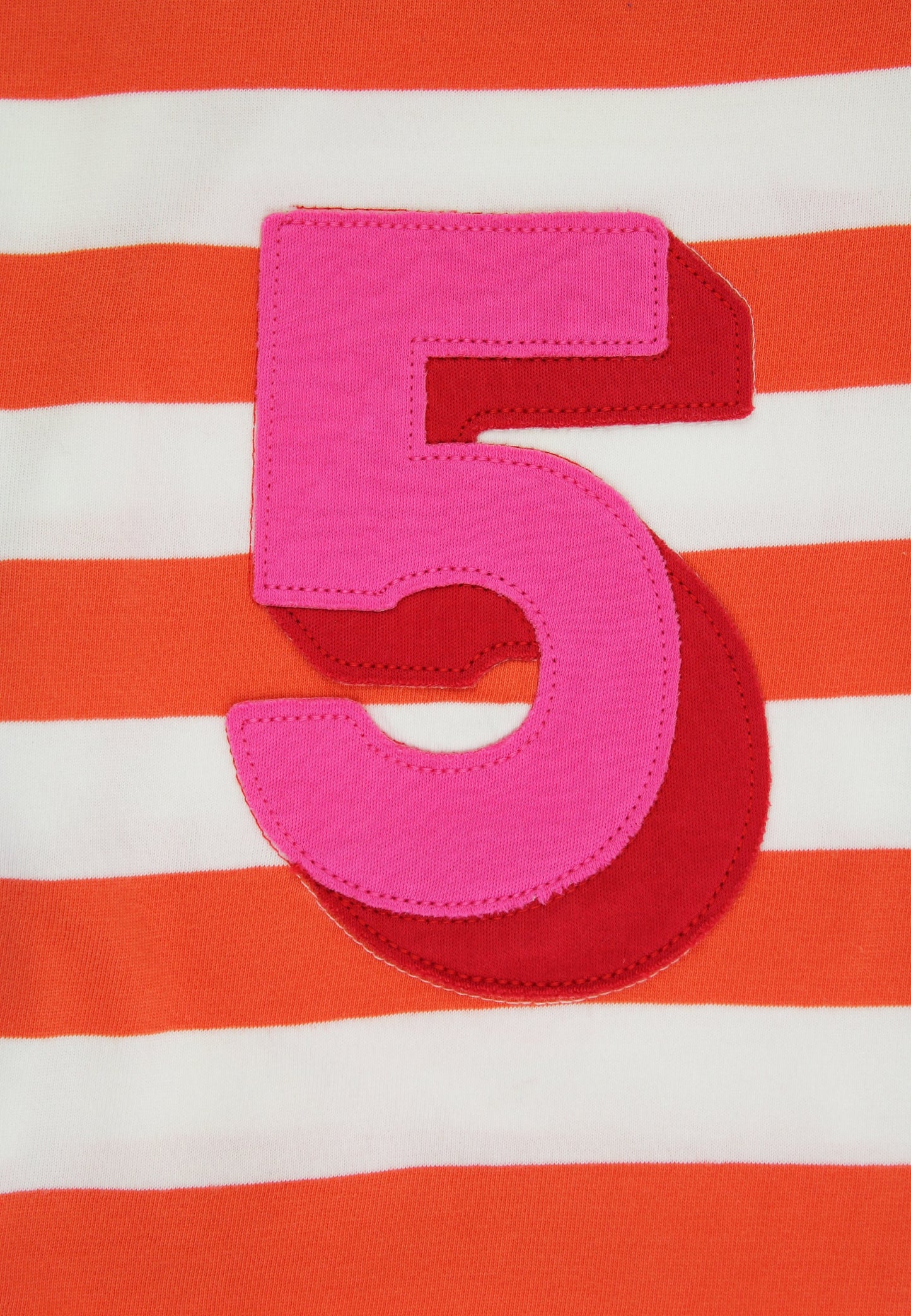 Pink number '5' on a red and white striped background