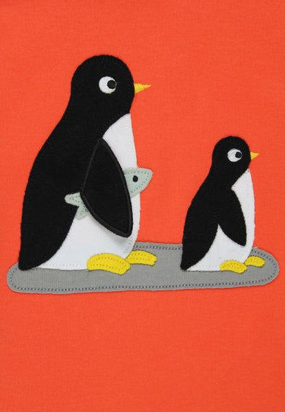 Two penguins on a red background