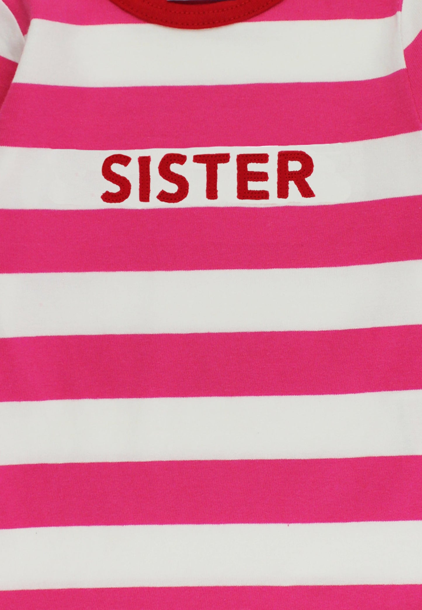 Pink and white striped shirt with 'SISTER' printed on it