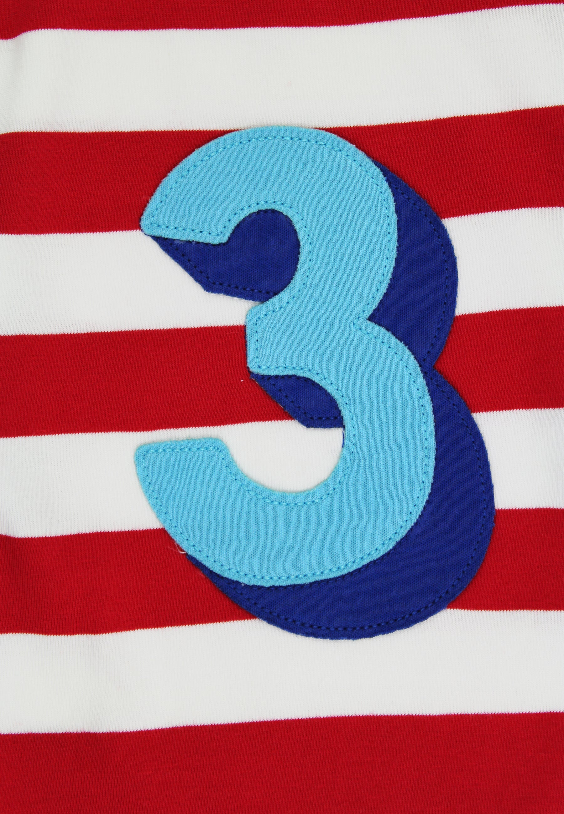 Red and white striped shirt with a blue number 3 on a red background