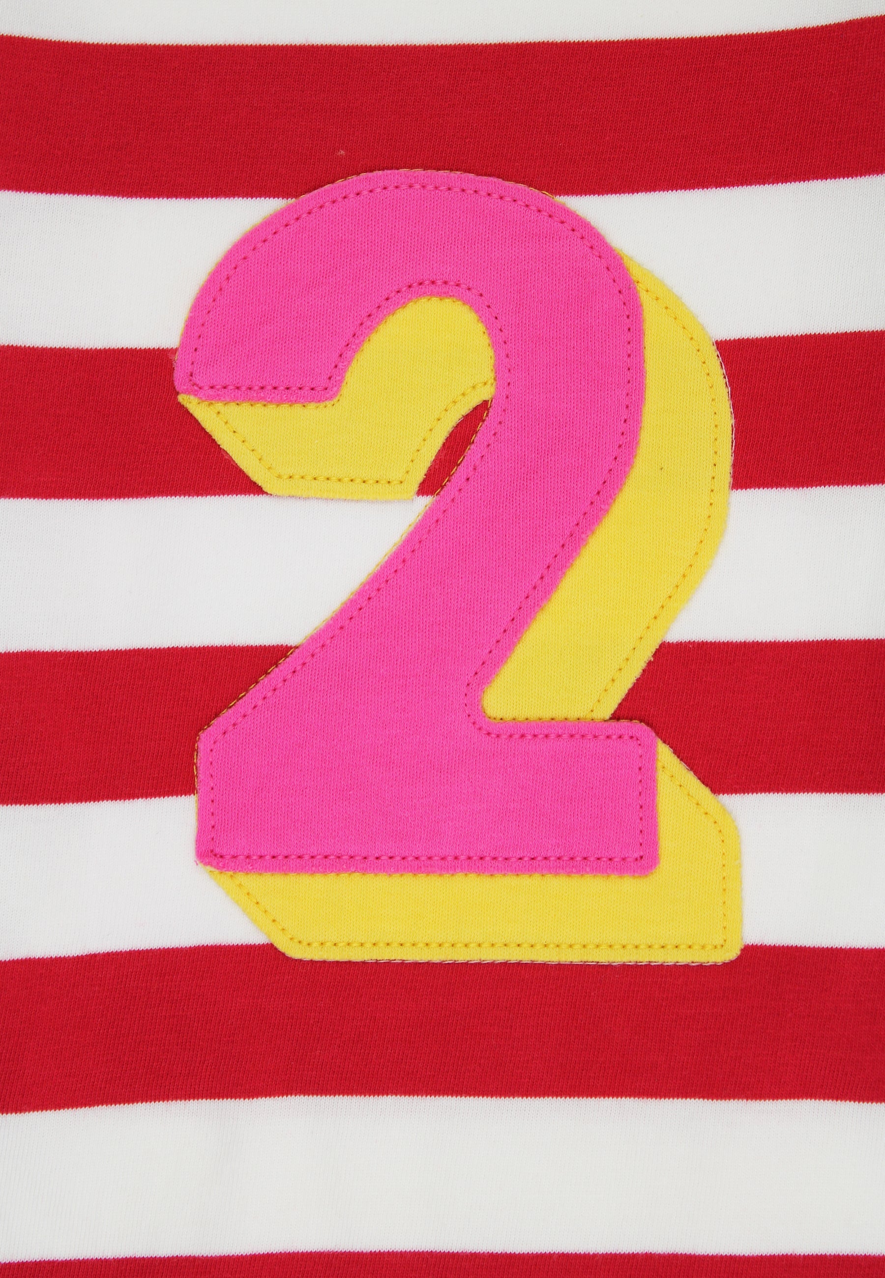 Pink and yellow number '2' on a red and white striped background