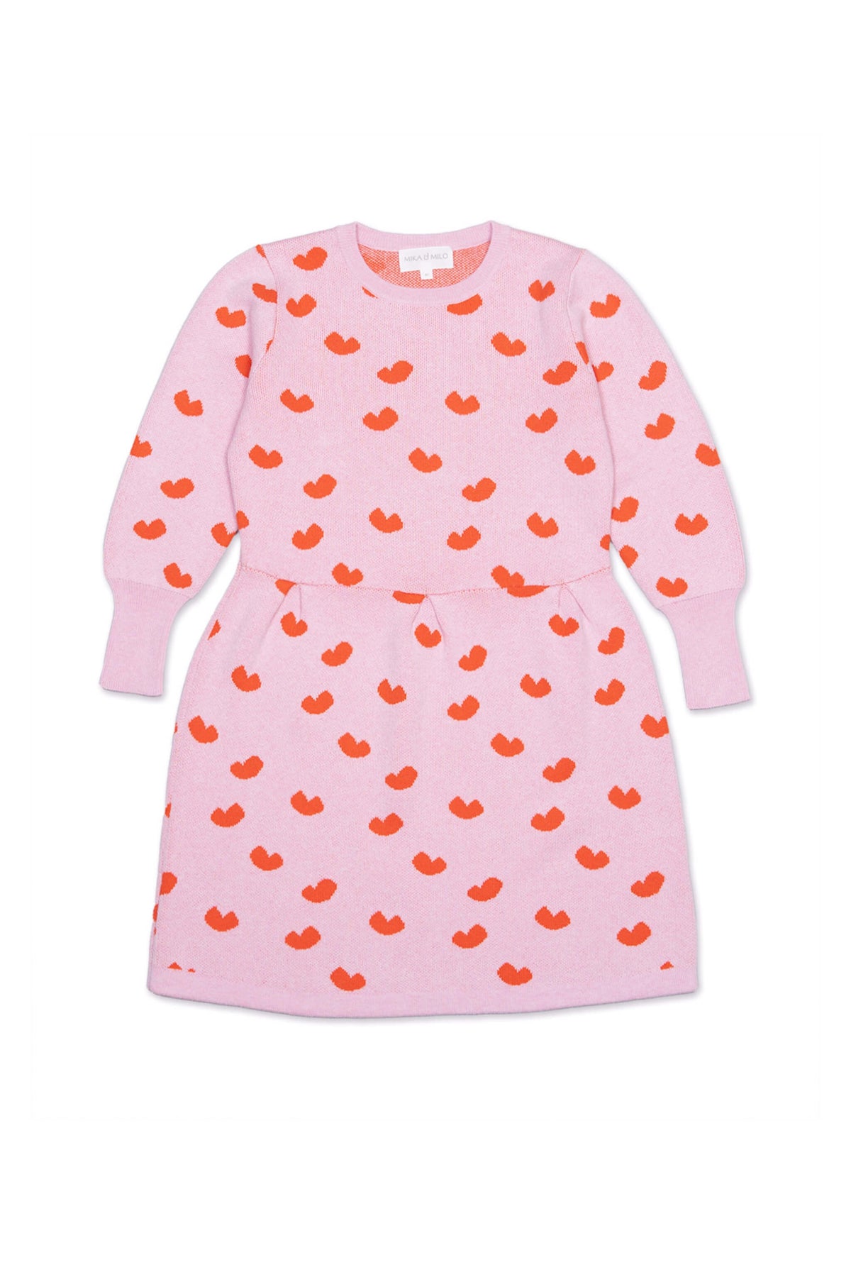 Front view of the Love Hearts Dress in bubble gum pink with lolly pop red jacquard hearts and a pleated waist