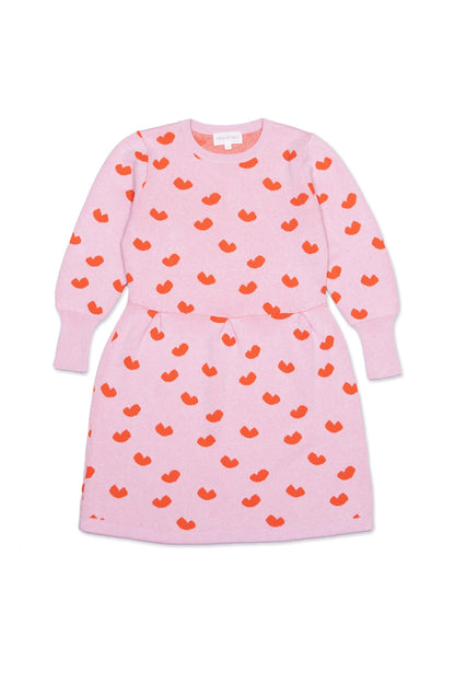 Front view of the Love Hearts Dress in bubble gum pink with lolly pop red jacquard hearts and a pleated waist
