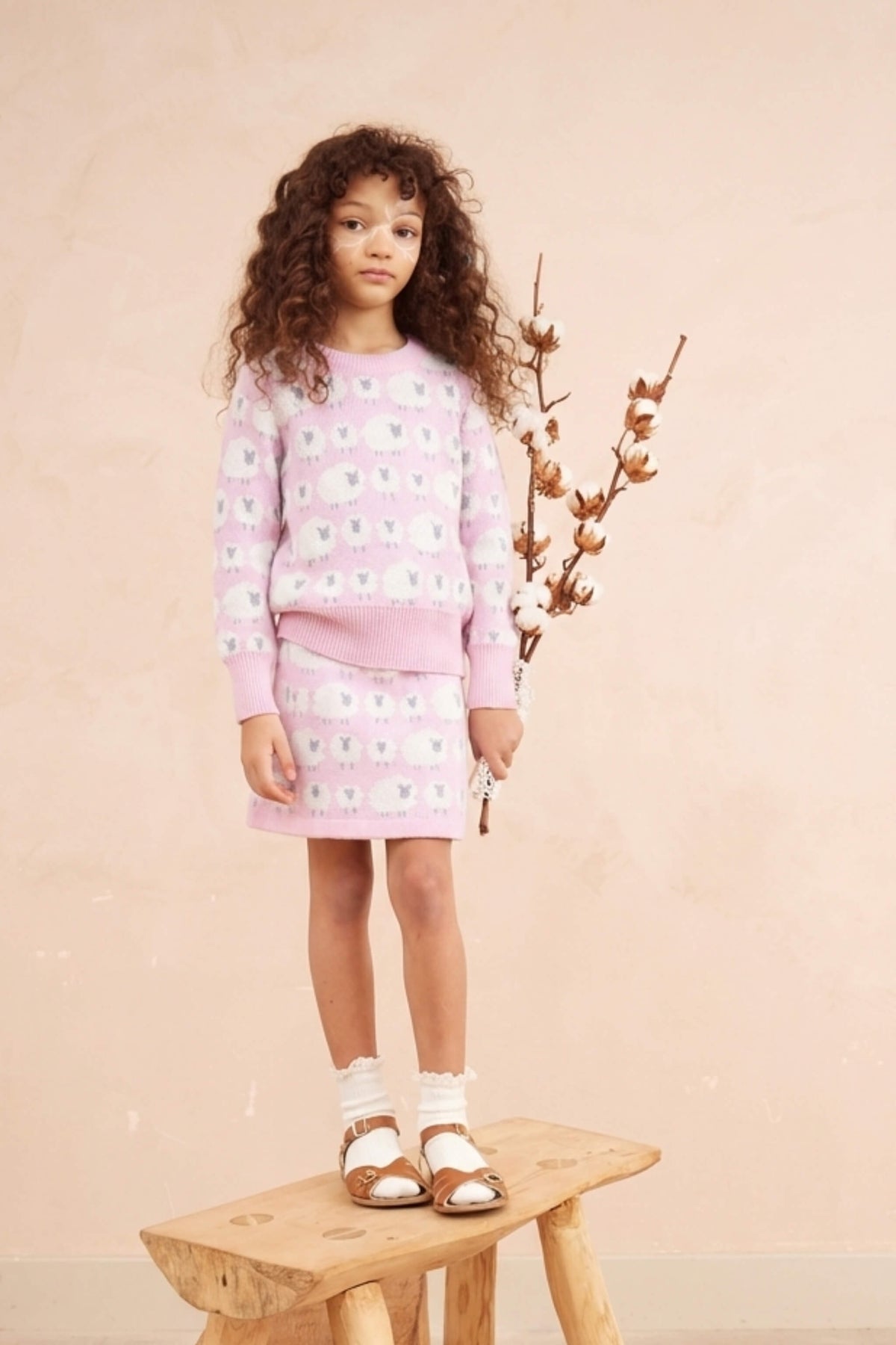 Girl wearing the Little Bo Peep Skirt in bubble gum pink