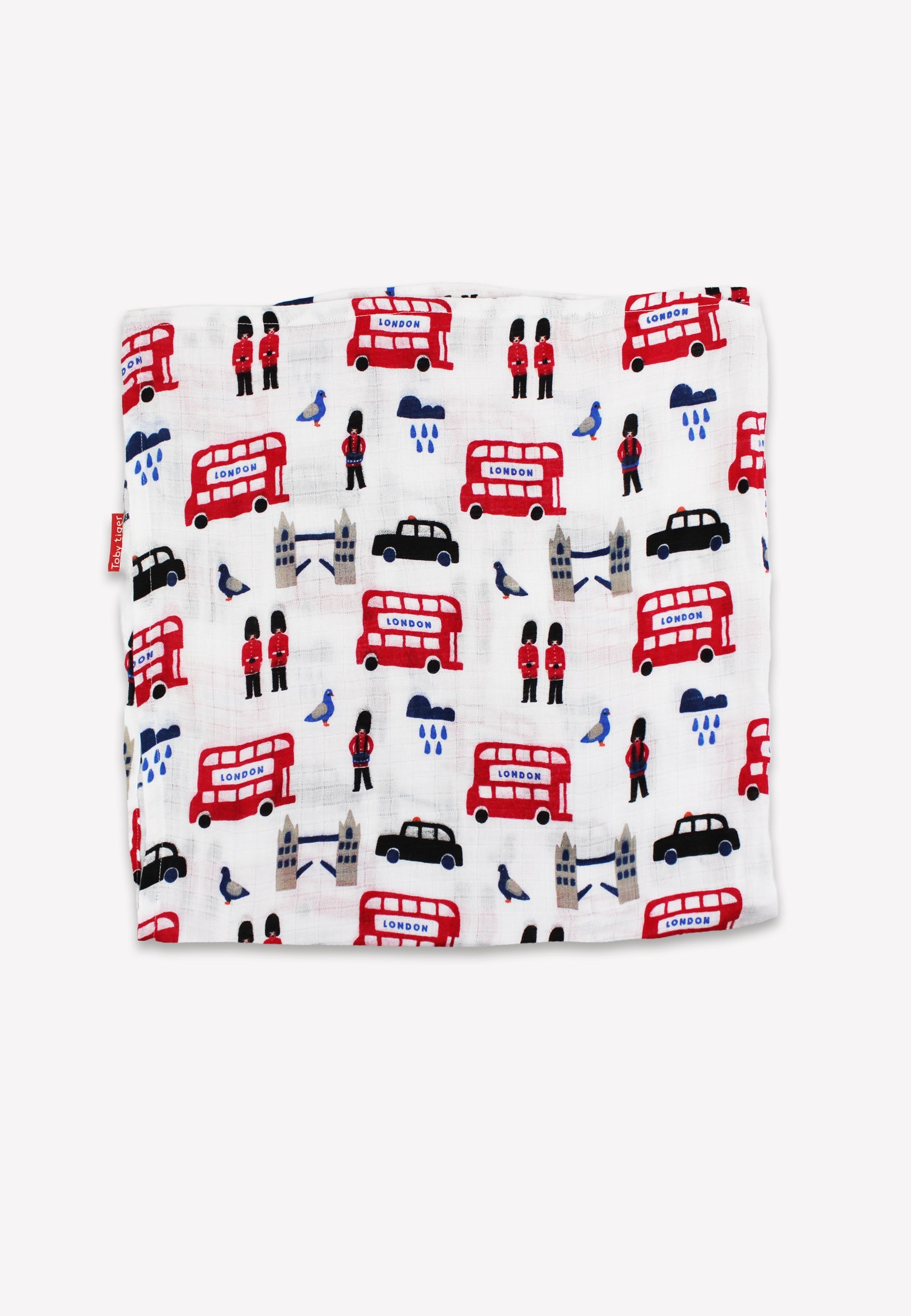 Baby blanket with London-themed design featuring red double-decker buses, black taxis, and other elements on a white background.