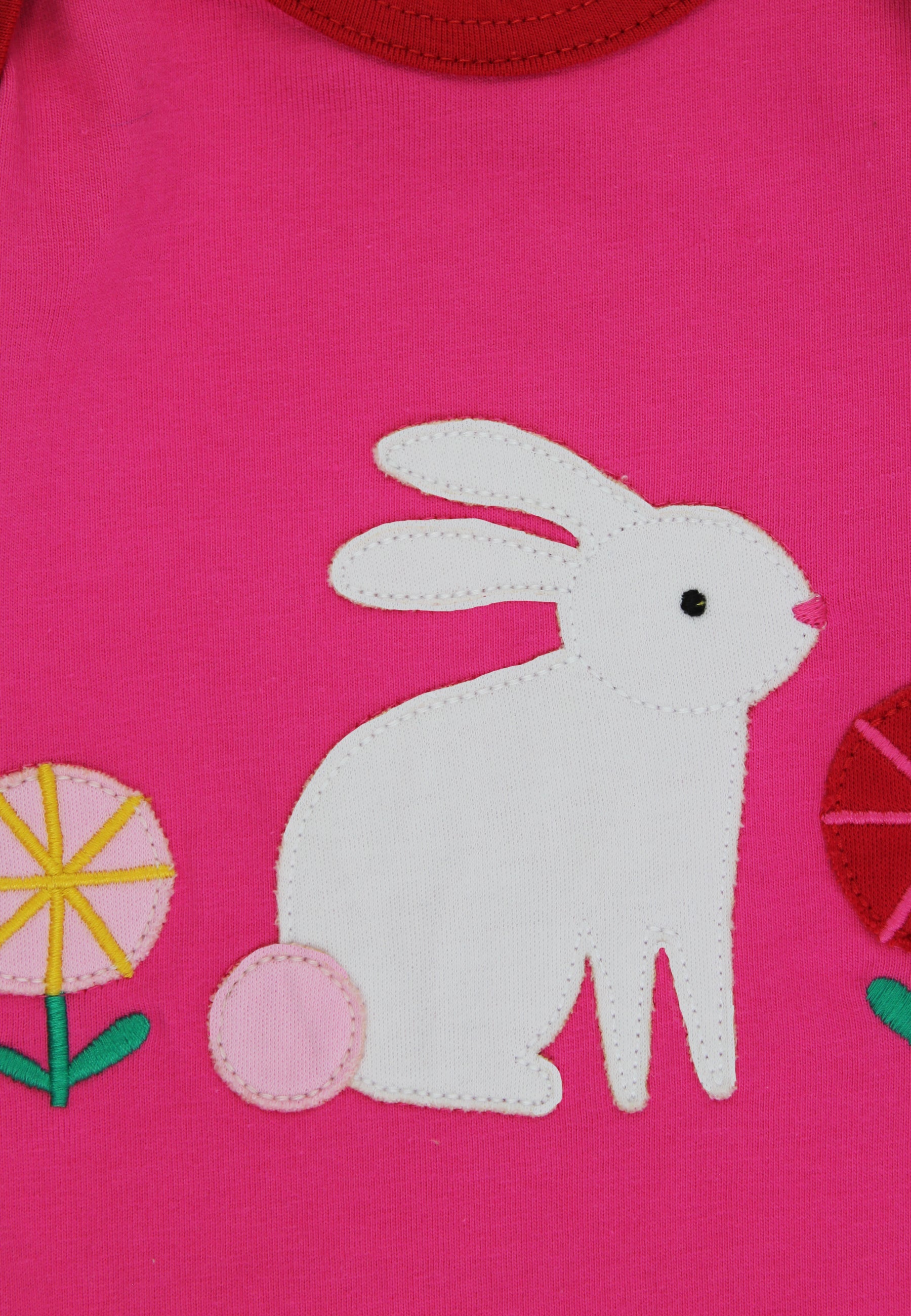 White rabbit design on a pink background