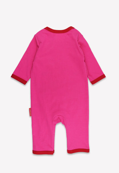 Pink baby onesie with red trim on a white background