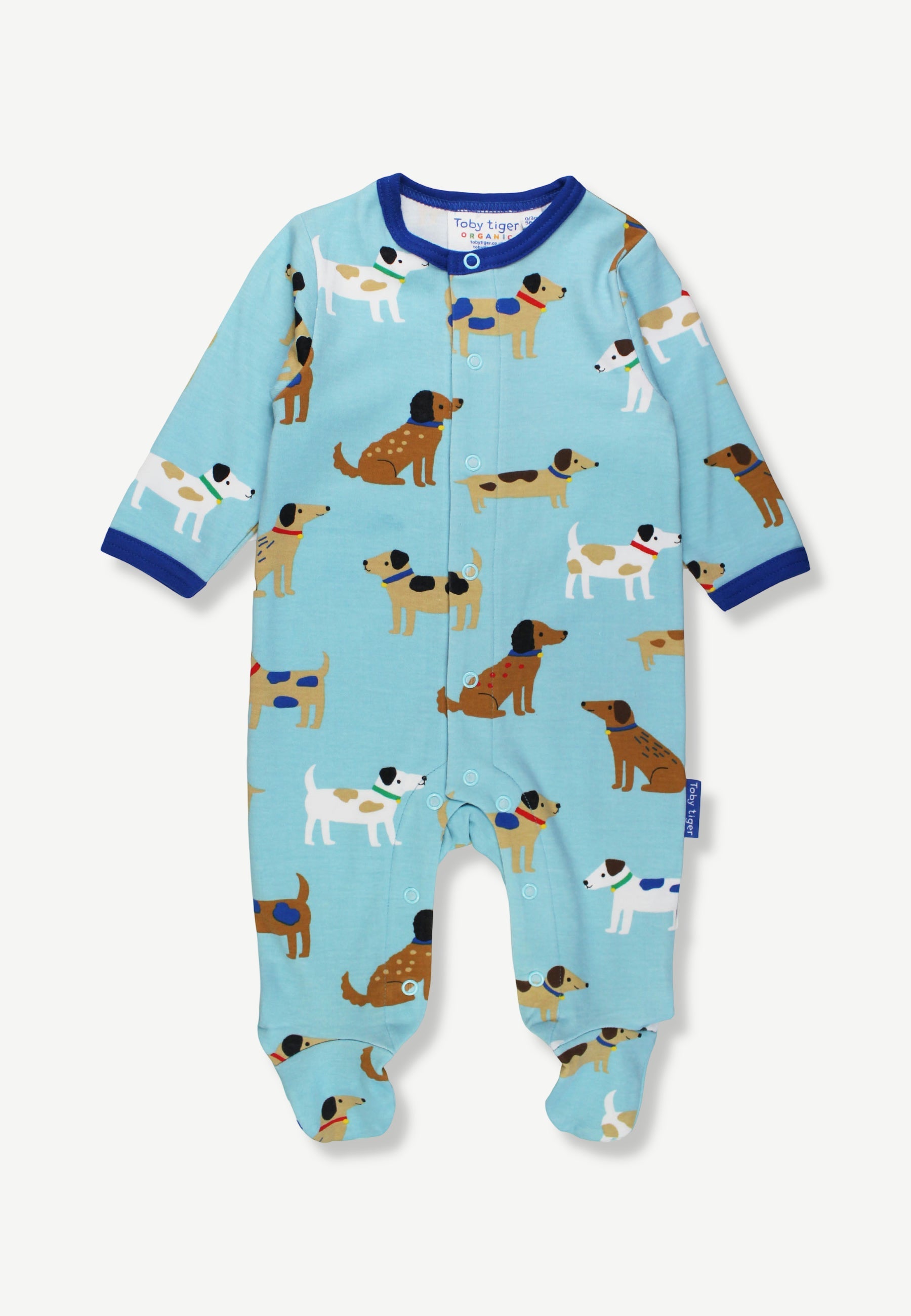 A baby footed sleeper in light blue with an all-over print of cartoon dachshunds, featuring dark blue trim at the collar and cuffs, shown flat on a light background.
