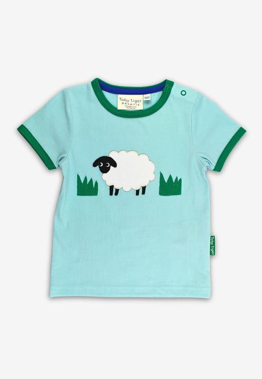 Light blue t-shirt with a sheep design on a white background