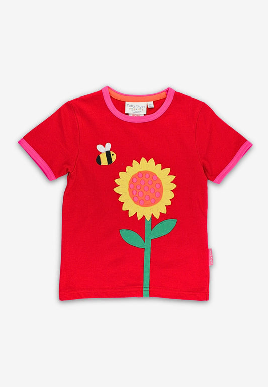 Red t-shirt with a sunflower design on a white background