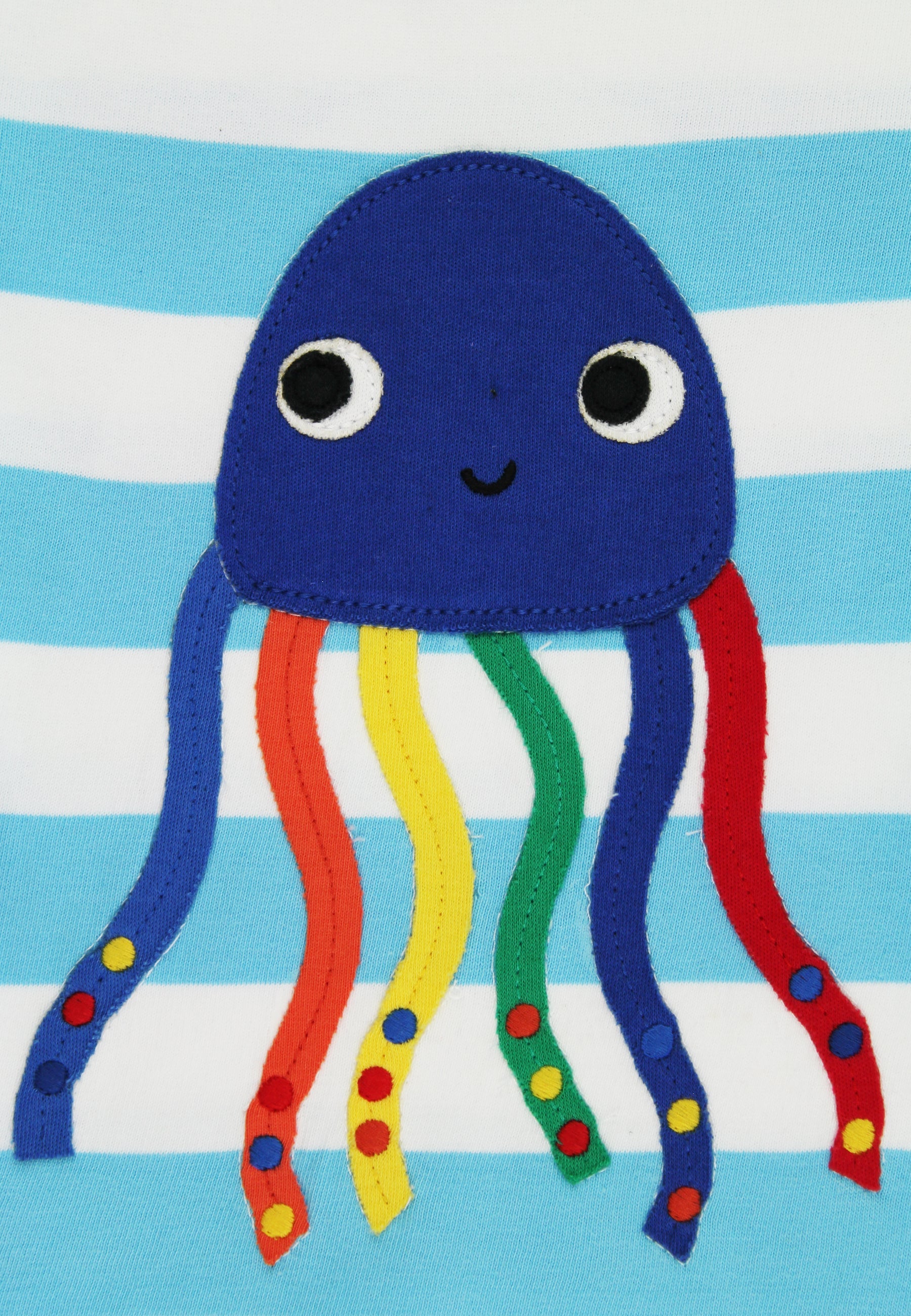 Blue jellyfish plush toy with colorful tentacles on a blue and white striped background