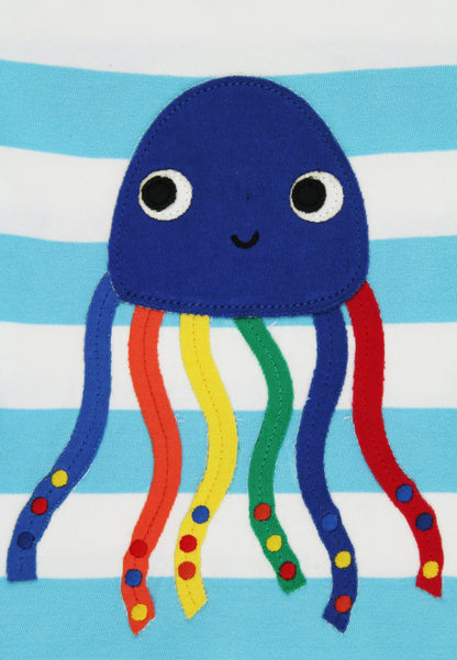 Blue jellyfish plush toy with colorful tentacles on a blue and white striped background
