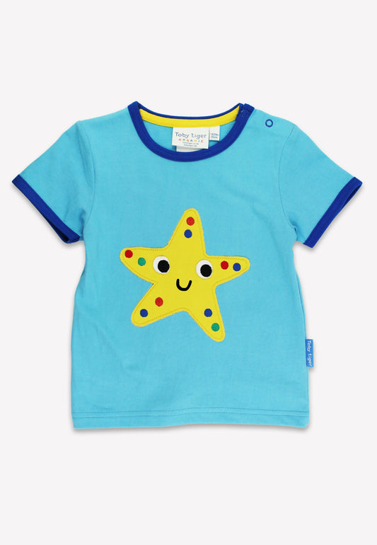 Blue t-shirt with a yellow star design on a white background