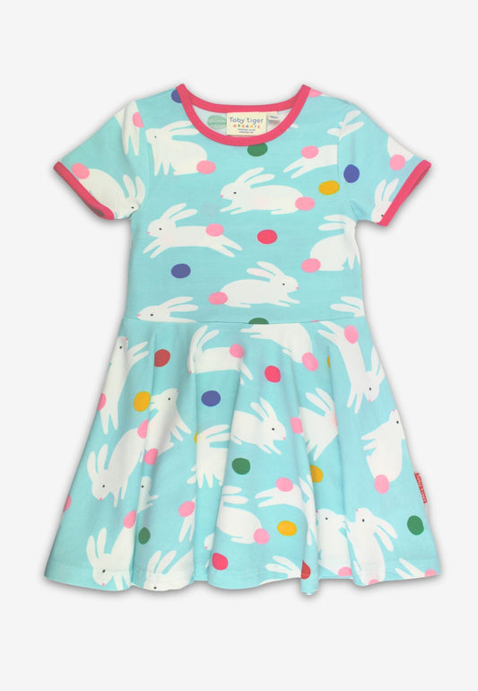Children's dress with bunny and polka dot pattern on a light blue background