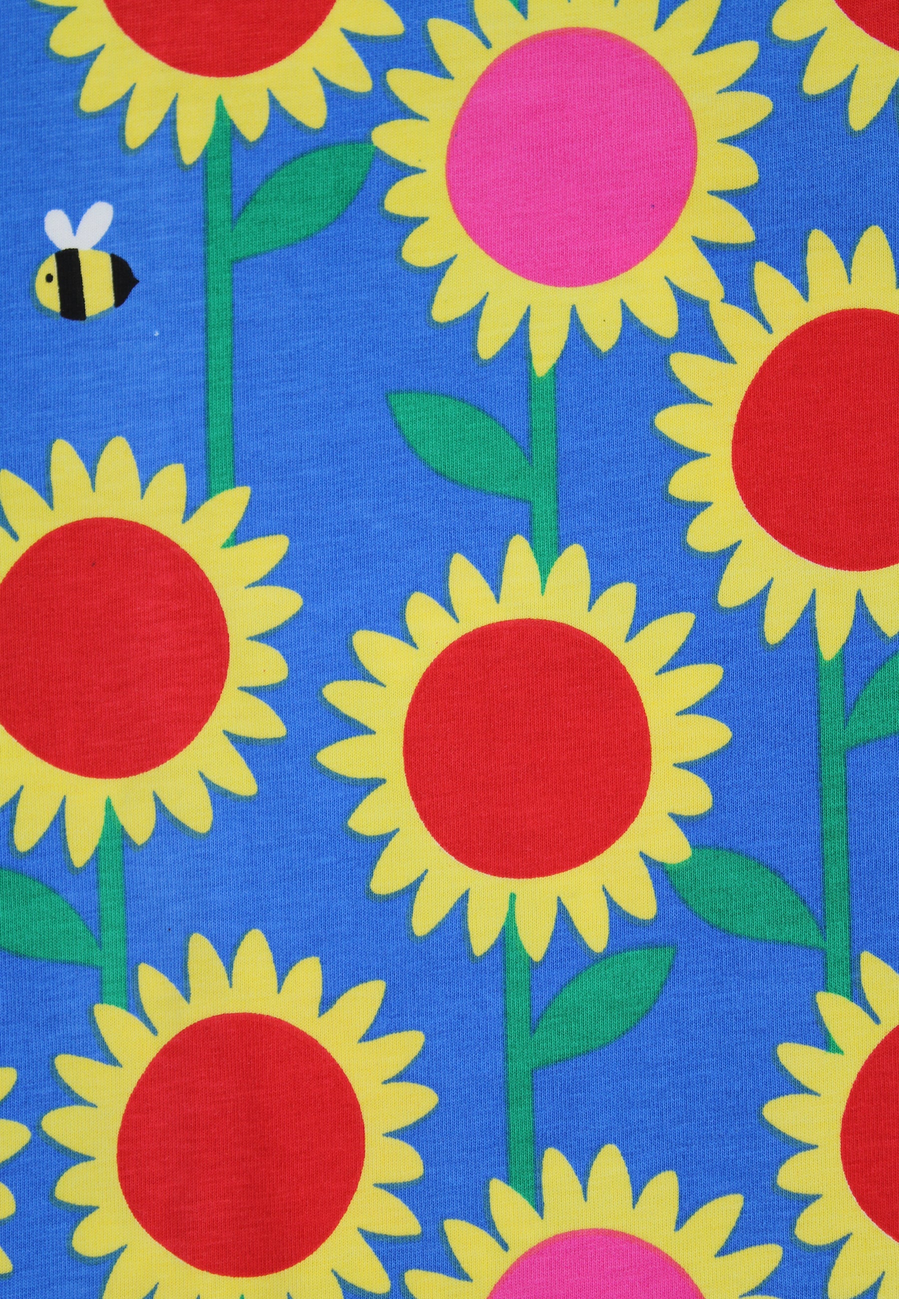 Pattern of sunflowers with red centers and yellow petals on a blue background, featuring a bee.