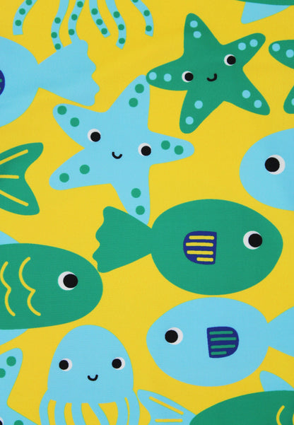 Pattern of cartoonish fish, starfish, and octopus on a yellow background