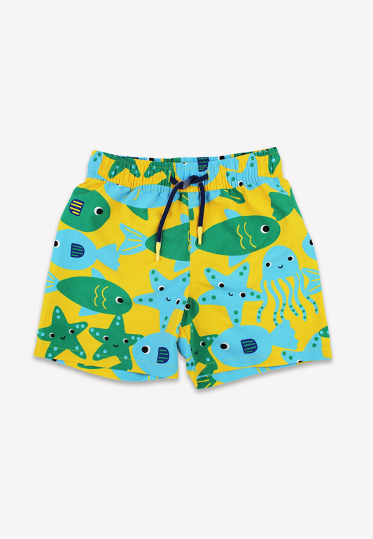 Yellow board shorts with green and blue fish and sea creatures print.