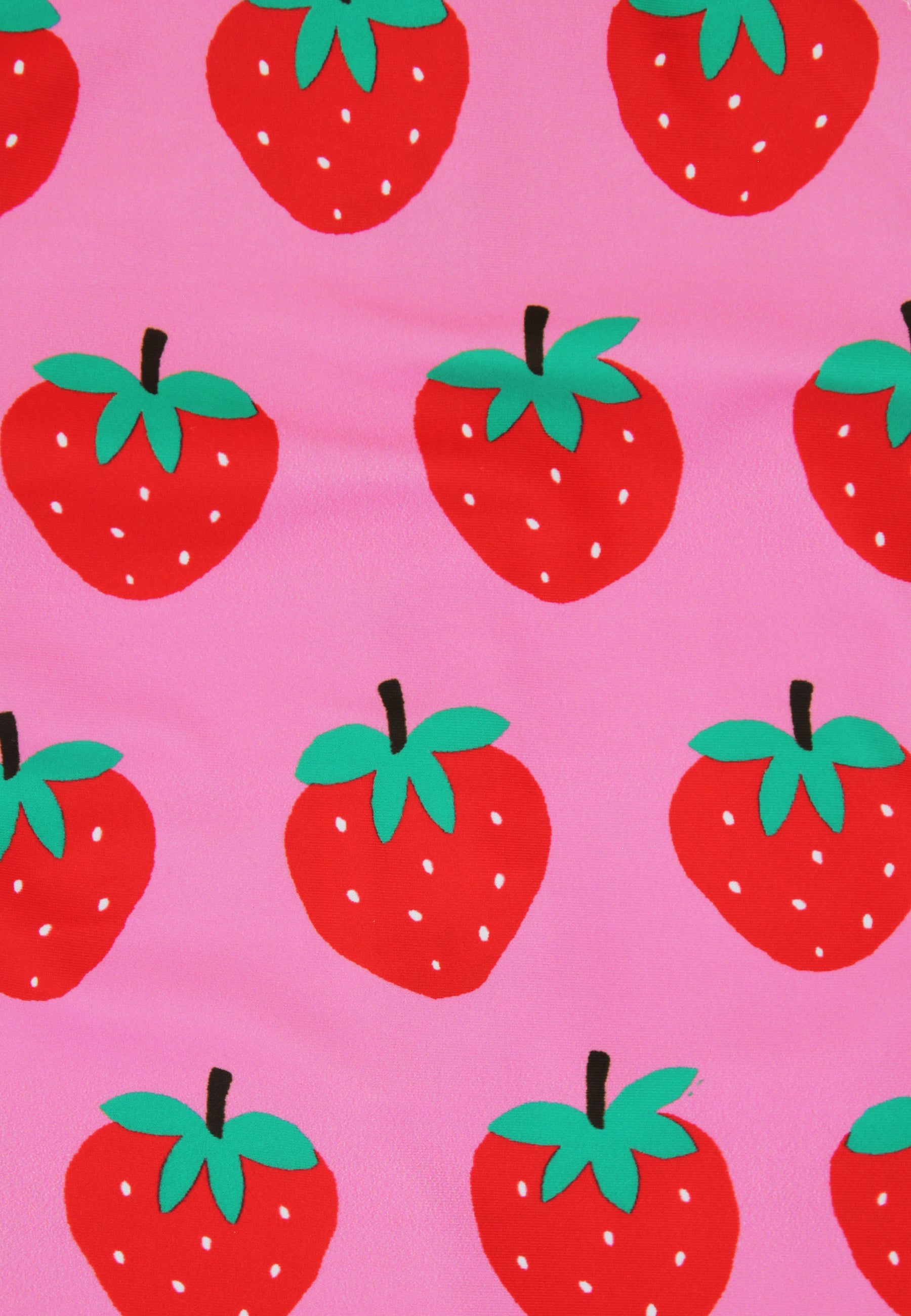 Pattern of red strawberries with green leaves on a pink background