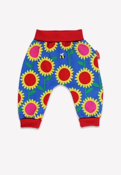 Colorful children's pants with sunflower pattern on a white background