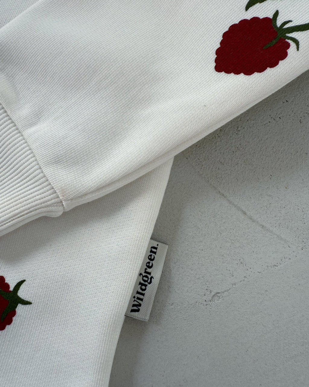 Wildgreen raspberry print long-sleeve sweater made from 100% organic undyed cotton. Unisex sustainable kidswear