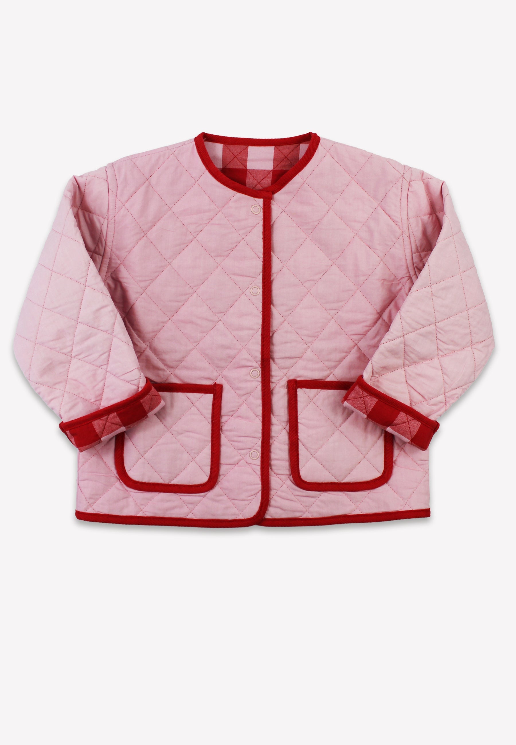 Pink quilted jacket with red trim and buttons.