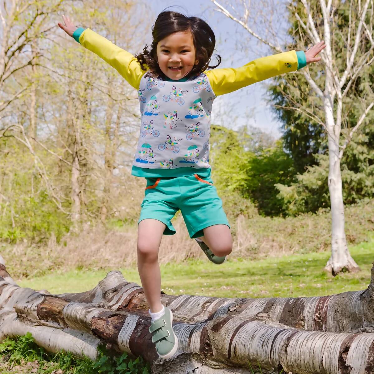 Ducky_Zebra_Organic_Cotton_Turquoise_Unisex_Kids_Baby_Shorts_And_Ducky_Zebra_Sweatshirt_Jumping_from_Tree_Happy_Fun_1200x.jpg