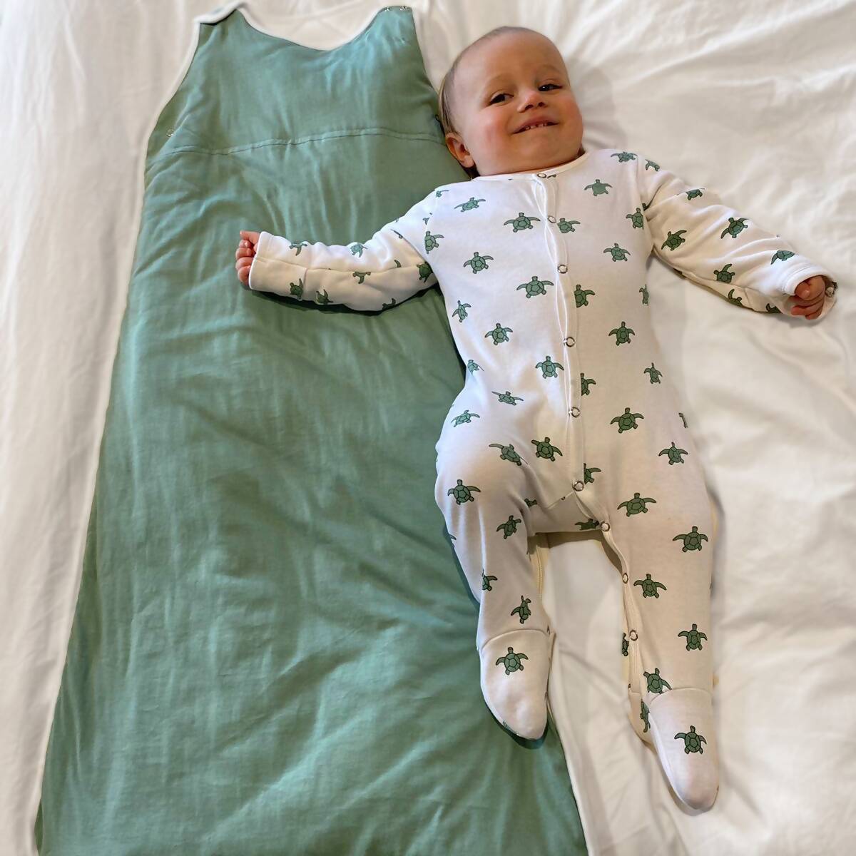 baby-in-sleepsuit-with-sleeping-bag (1)