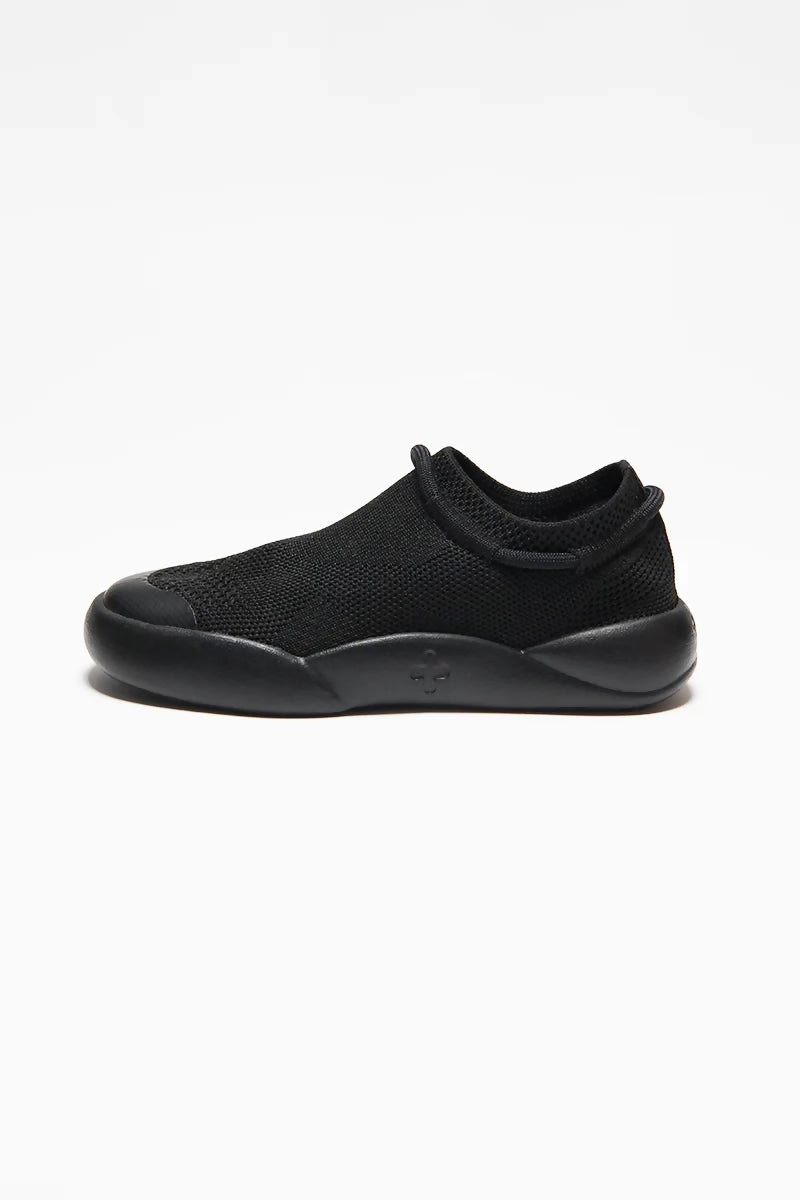 Black-childrens-trainers-made-from-recycled-plastic-sugarcane-sole-side-view